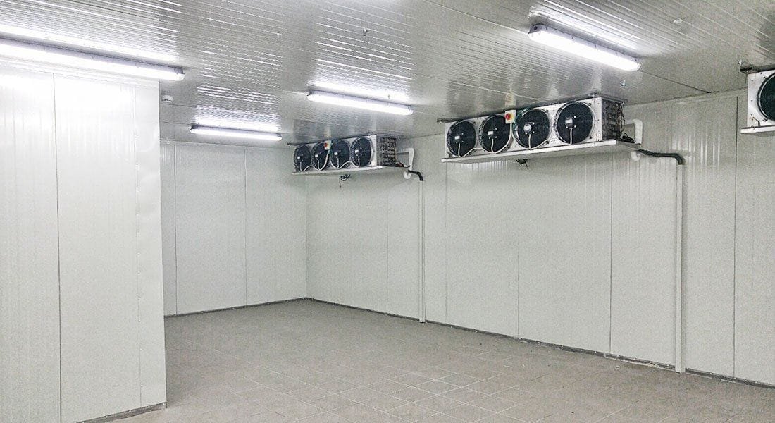Cold room built from insulated panels, with wall-mounted cooling units